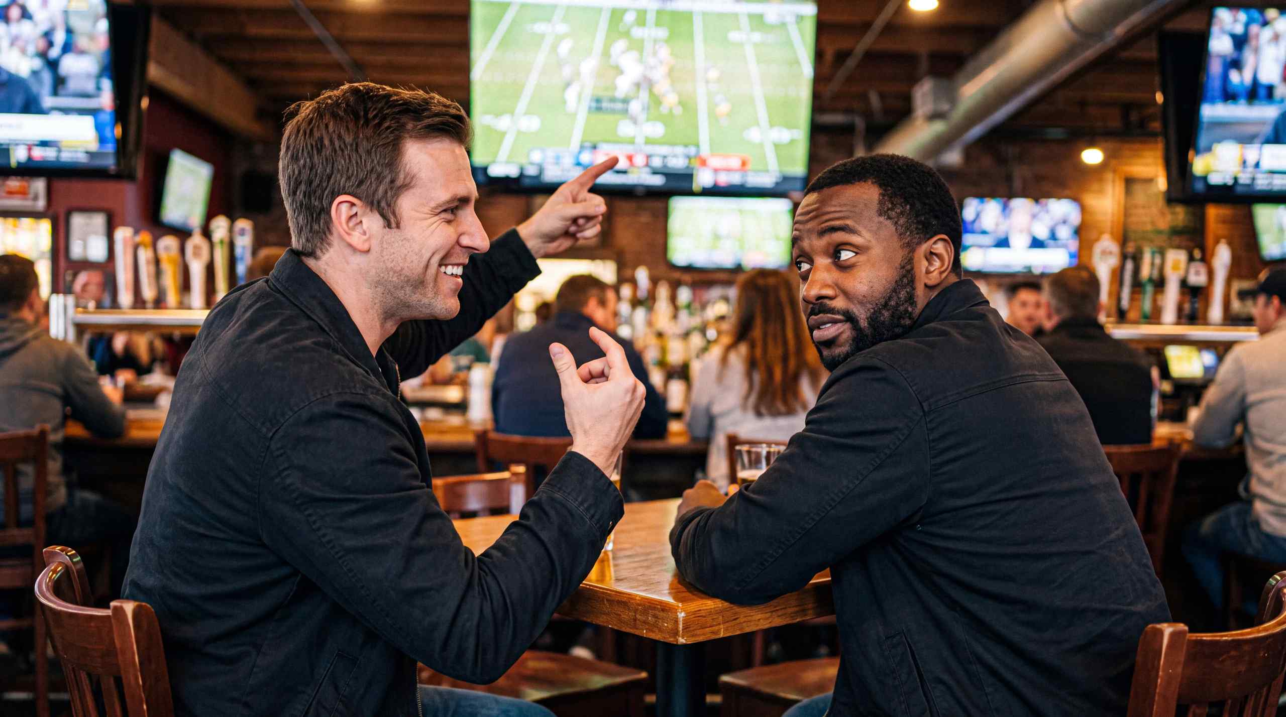 Two friends watching football